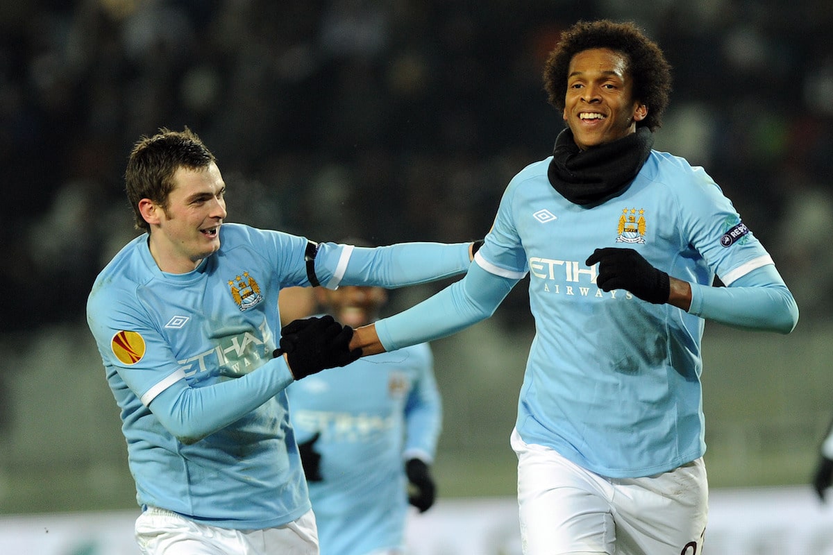 Manchester City's Jo, right, celebrates with teammate Adam Johnson after scoring during the Europa League