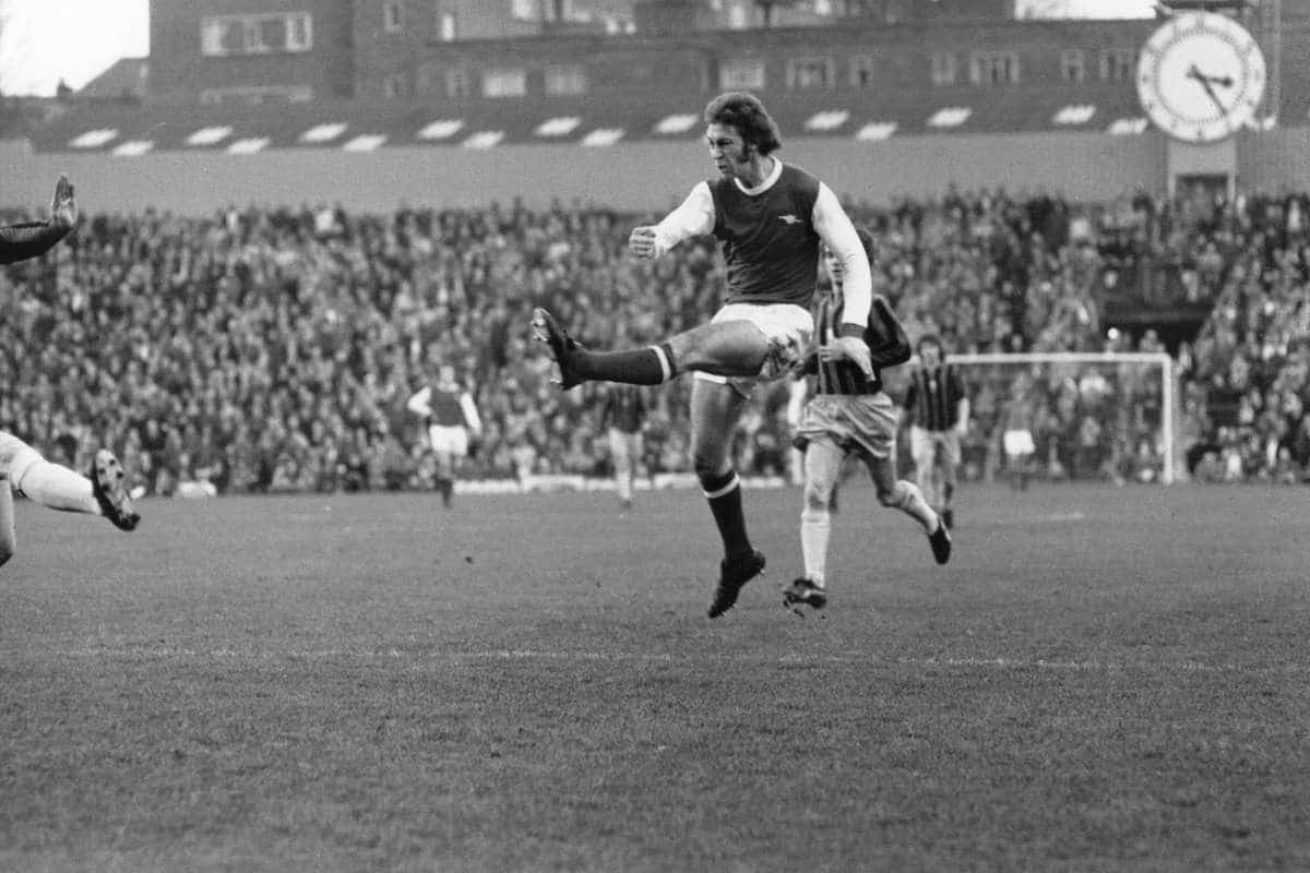 Arsenal's Charlie George has a shot at goal