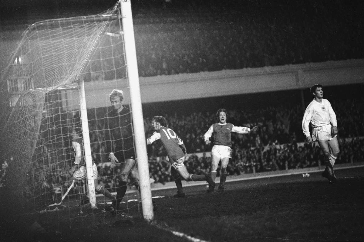 Charlie George celebrates scoring for Arsenal