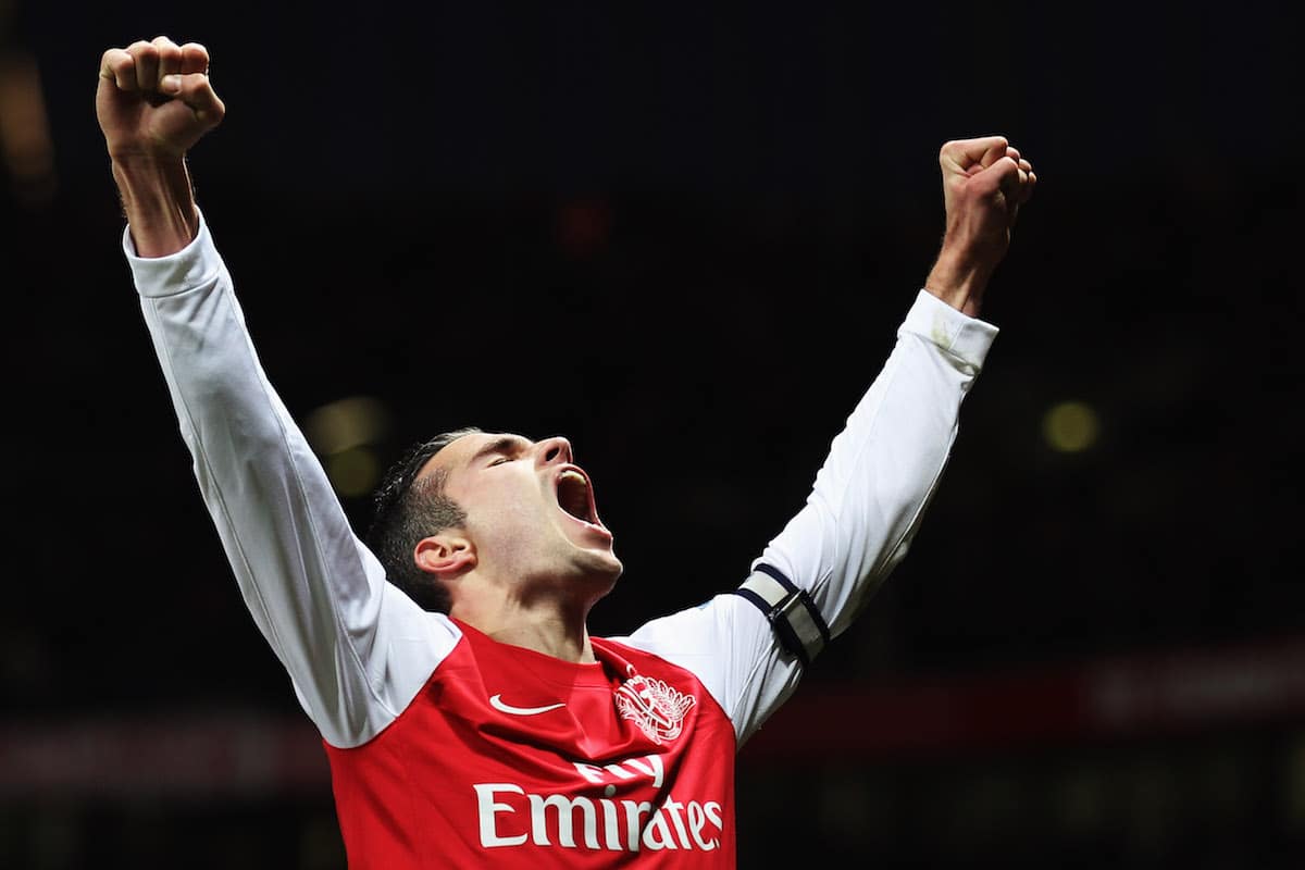 Arsenal striker Robin van Persie celebrates scoring against Queens Park Rangers in the Premier League