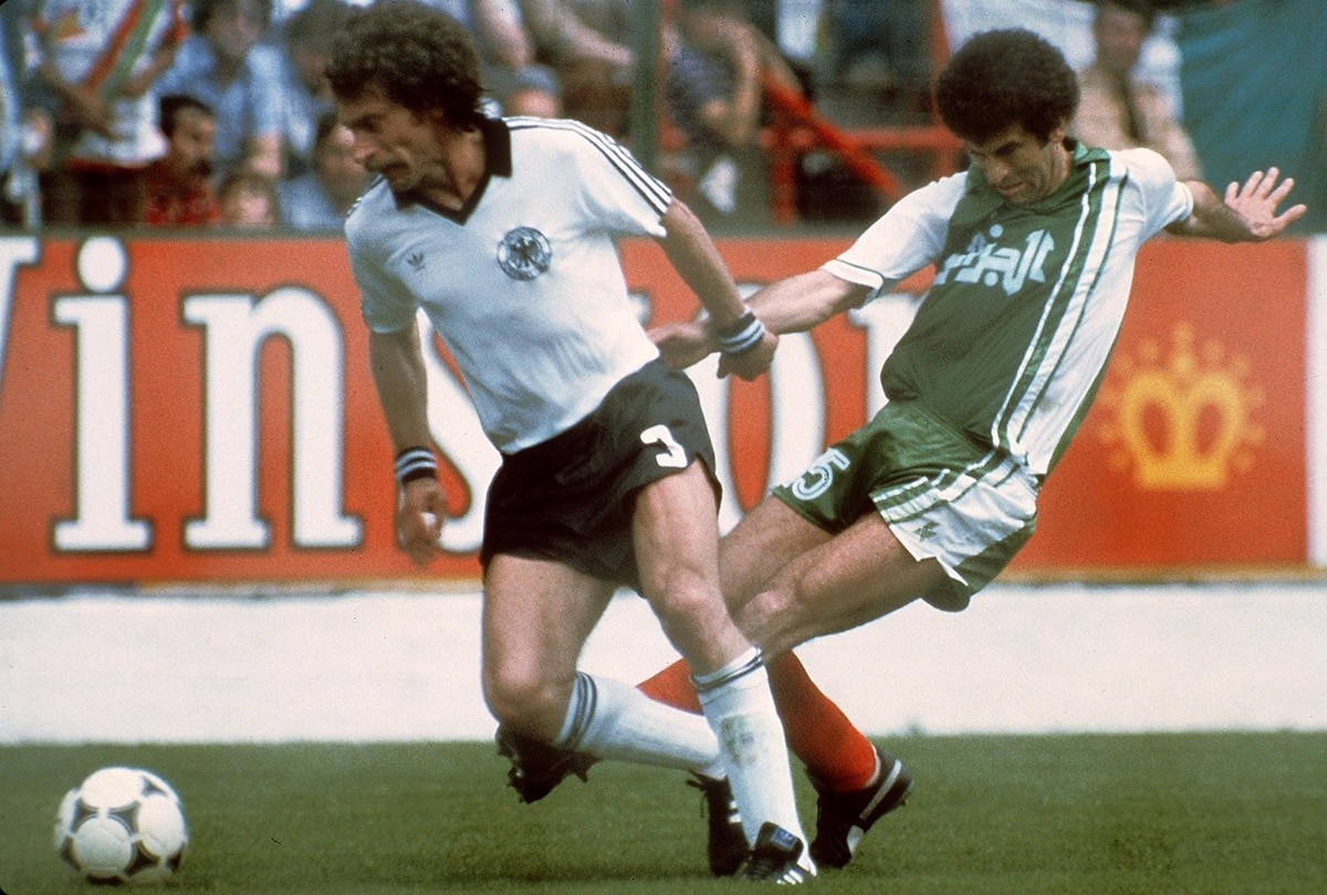 West Germany defender Paul Breitner and Algeria midfielder Mustapha Dahleb at 1982 World Cup