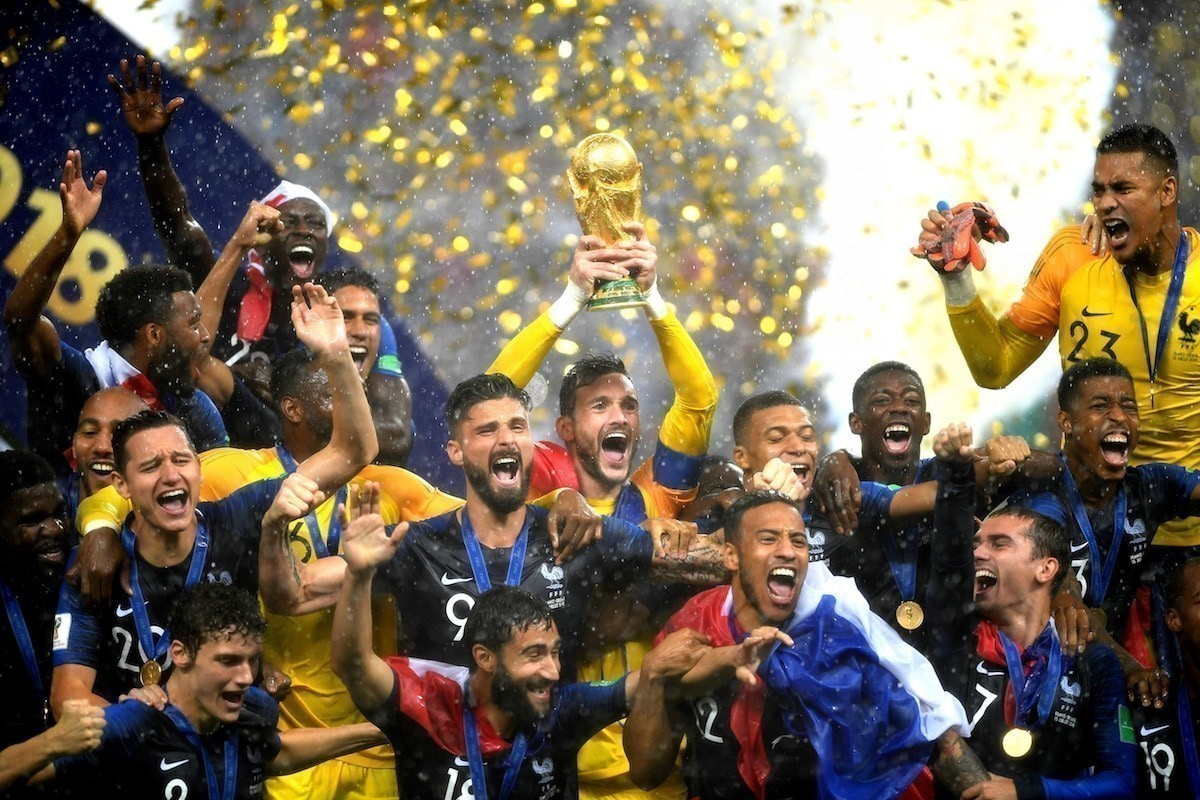 Hugo Lloris of France lifts the World Cup trophy to celebrate with his teammates after the 2018 FIFA World Cup Final between France and Croatia