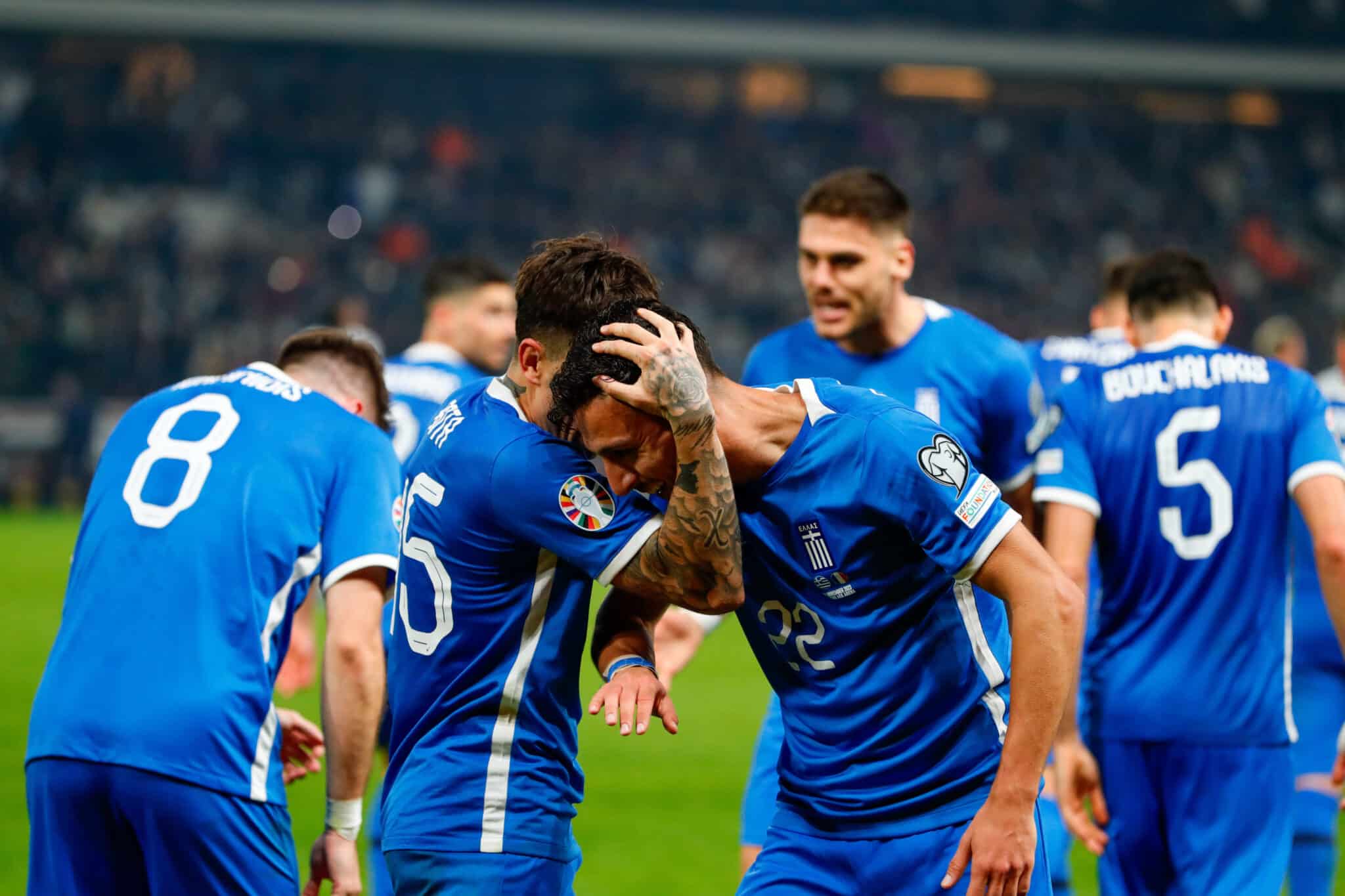 Greece players celebrate a goal 