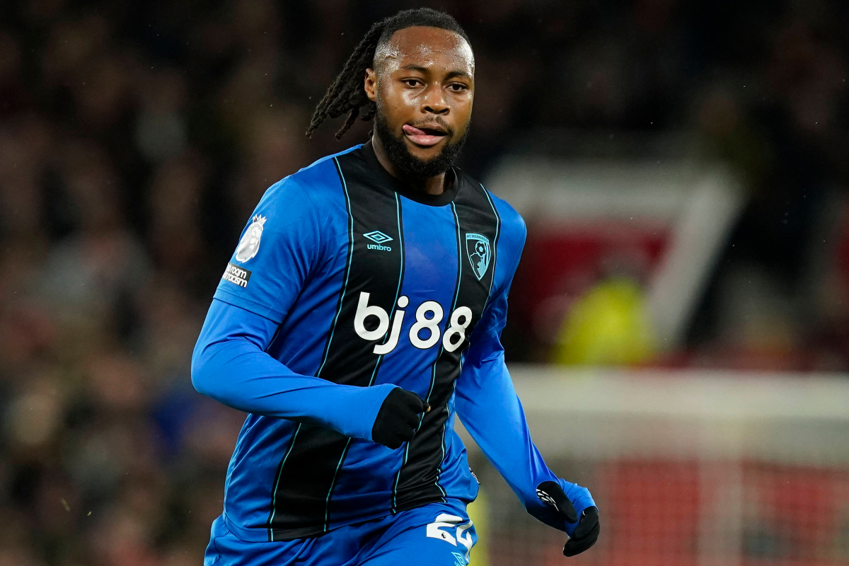 Antoine Semenyo of Bournemouth, wearing the blue and black stripe away kit. 